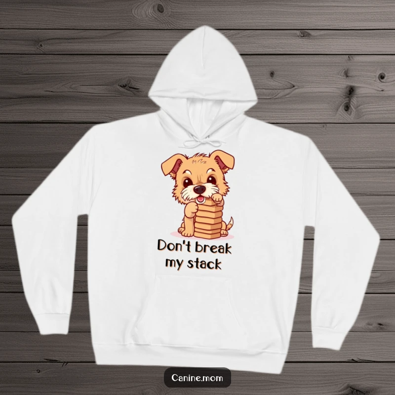 Funny hoodie featuring a mischievous terrier attempting to balance a tower of dog biscuits, embodying playful silliness and focus.